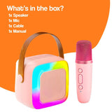Family Fun Karaoke Machine with wireless speaker, pink microphone, and colorful LED lights for kids aged 3+
