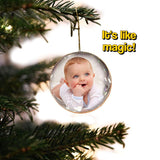3D holographic video memory ball glowing on holiday table with Christmas tree background